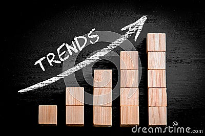 Word Trends on ascending arrow above bar graph Stock Photo