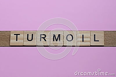 word turmoil from small gray wooden letters Stock Photo