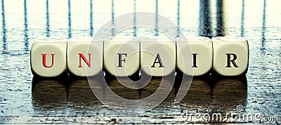 Word Unfair or fair inside dices Stock Photo