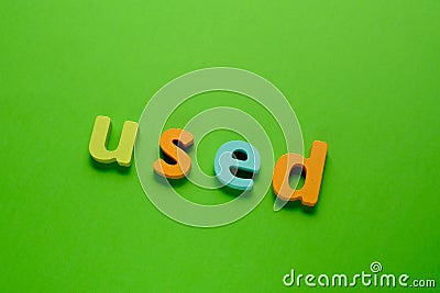 Word USED on green background. Learning the English alphabet and language.The concept of education, school, kindergarten Stock Photo