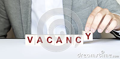 Word VACANCY made with wood building blocks Stock Photo
