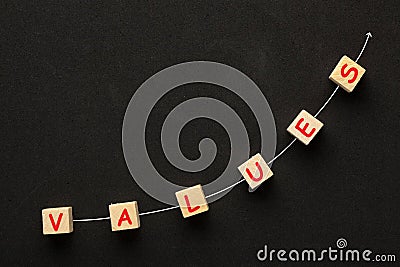 Values With Directional Arrow Stock Photo