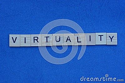 Word virtuality from gray small wooden letters with black font Stock Photo