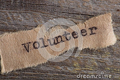 Word Volunteer typed on a small piece of paper on vintage typewriter Stock Photo