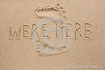 Word WERE HERE written on the sand Stock Photo