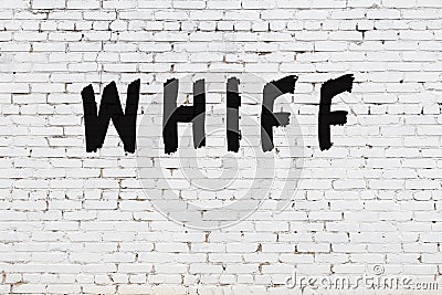 Word whiff painted on white brick wall Stock Photo