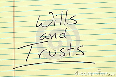 Wills and trusts on a yellow legal pad Stock Photo