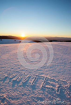 Word winter written in snow Stock Photo
