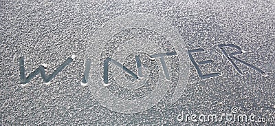 Word winter written on snowy windshield Stock Photo