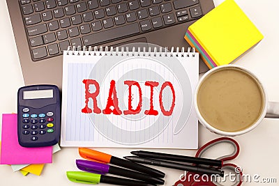 Word writing Radio in the office with laptop, marker, pen, stationery, coffee. Business concept for Media and Education Workshop Stock Photo