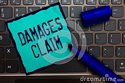 Word writing text Damages Claim. Business concept for Demand Compensation Litigate Insurance File Suit Turquoise paper keyboard In Stock Photo