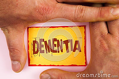 Word writing text Dementia. Business concept for Long term memory loss sign and symptoms made me retire sooner written on Yellow S Stock Photo