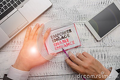 Word writing text Empower Engage Enable Enhance. Business concept for Empowerment Leadership Motivation Engagement. Stock Photo