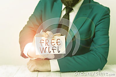 Word writing text Free Wifi. Business concept for let you connect to the Internet in public places without paying Man Stock Photo