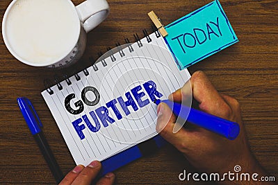 Word writing text Go Further. Business concept for To move to a greater distance or overcome your limitations Man holding marker n Stock Photo