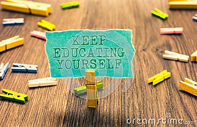 Word writing text Keep Educating Yourself. Business concept for dont stop studying Improve yourself using Courses Clothespin holdi Stock Photo