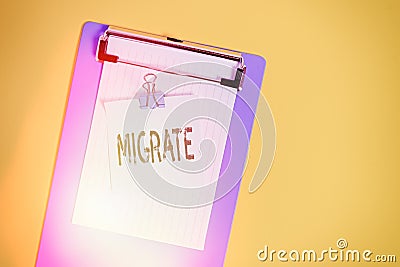 Word writing text Migrate. Business concept for to move or travel from one country place or locality to another Slim clipboard Stock Photo