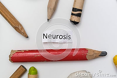 A word writing text neurosis among pencils, writing a diary and describing psycholigical problem, art therapy concept Stock Photo