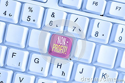 Word writing text NonProfit. Business concept for not making or conducted primarily to make profit organization White pc keyboard Stock Photo