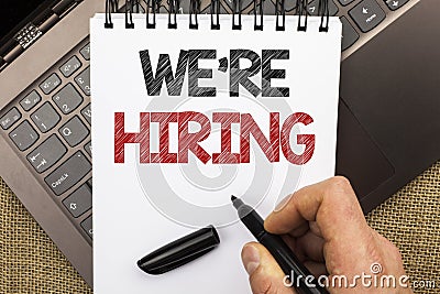 Word writing text We're Hiring. Business concept for Recruiting Hiring Now Recruitment Vacancy Announced Hire written by Man Hold Stock Photo