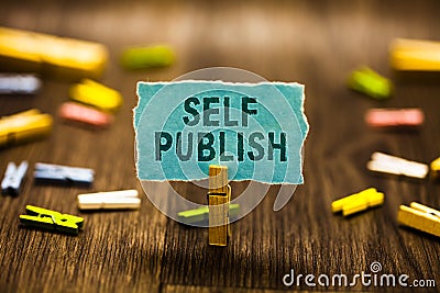 Word writing text Self Publish. Business concept for Published work independently and at own expense Indie Author Clothespin holdi Stock Photo
