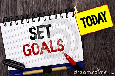 Word writing text Set Goals. Business concept for Target Planning Vision Dreams Goal Idea Aim Target Motivation written on Noteboo Stock Photo