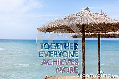 Word writing text Together Everyone Achieves More. Business concept for Teamwork Cooperation Attain Acquire Success Blue beach wat Stock Photo