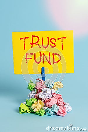 Word writing text Trust Fund. Business concept for money that is being held by the trustees for the beneficiaries Reminder pile Stock Photo