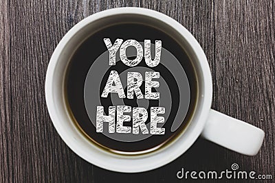 Word writing text You Are Here. Business concept for This is your location reference point global positioning system Black coffee Stock Photo