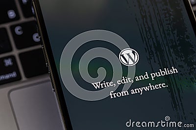 WordPress logo mobile app on a screen smartphone iPhone closeup. WordPress - open source site content management system Editorial Stock Photo