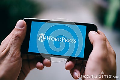 COLOGNE, GERMANY - MARCH 10, 2018: Closeup of iPhone Screen showing Wordpress Logo Editorial Stock Photo