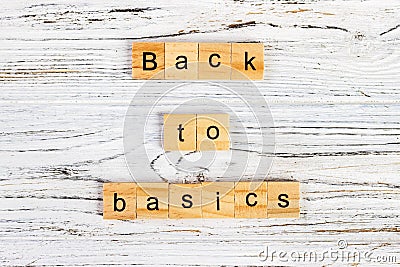 The words back to basics made of letters on wooden blocks. back to basics - fundamental principles concept Stock Photo