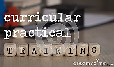 Words CURRICULAR PRACTICAL TRAINING composed of wooden dices Stock Photo