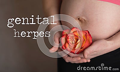 Words GENITAL HERPES. Young pregnant between 30 and 35 years old woman keeps rose blossom close to her belly in the background Stock Photo