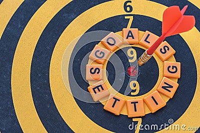 Words goals setting and dart target on bullseye Stock Photo