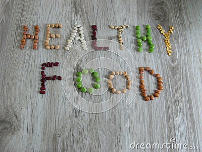 Words Healthy Food written with legumes or beans on wooden Stock Photo