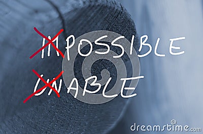 Words impossible unable concept handwritten on wooden log background Stock Photo