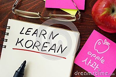 Words learn korean written in the notepad. Stock Photo