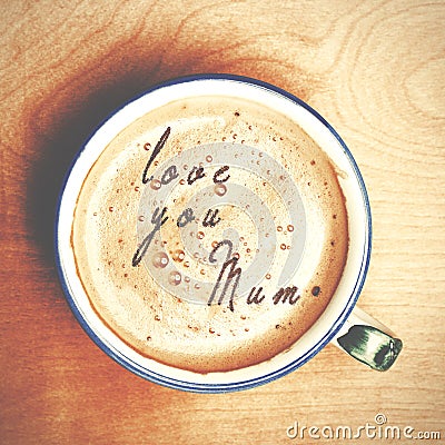 Words love you mum formed from coffee foam. Cup of cappuccino c Stock Photo