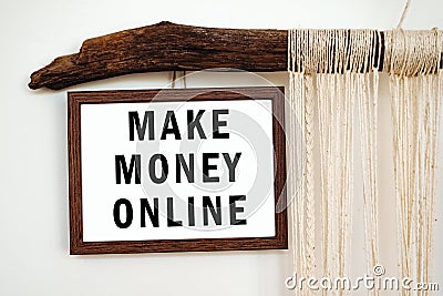 The words Make Money Online written on a white paper Stock Photo