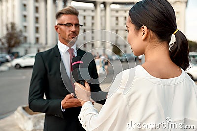 Words matter. Female journalist interviewing politician. Journalism industry, live streaming concept. Stock Photo