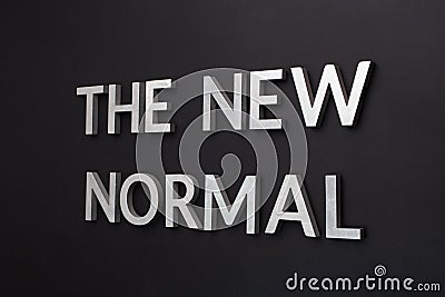 Words the new normal on black surface in tilted linear perspective Stock Photo