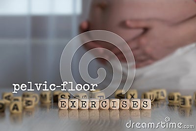 Words PELVIC-FLOOR EXERCISES composed of wooden letters Stock Photo