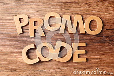 Words Promo Code made of wooden letters on table, flat lay Stock Photo