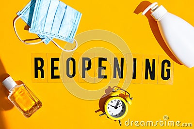 Words reopening text on the light box. New life, new business, new deals concept. Alarm clock. New normal Stock Photo