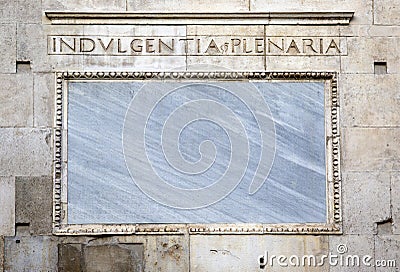 Words on stone. Facade of the cathedral of Modena. Italy Stock Photo