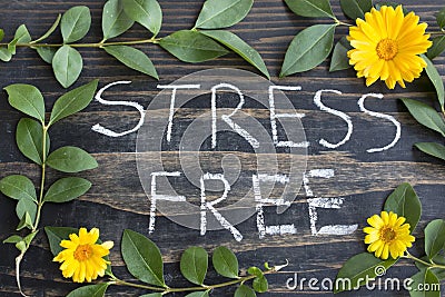 Words Stress Free with Leaves and Marigold Flowers Stock Photo