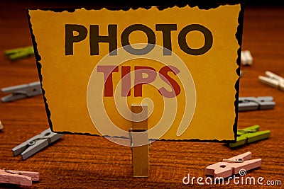 Word writing text Photo Tips. Business concept for Suggestions to take good pictures Advices for great photosgraphyClothespin hold Stock Photo