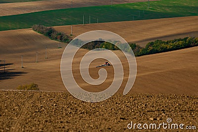 Work with an agricultural tractor in Moravian fields Stock Photo