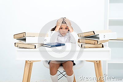 Work concept. Little child stressed with paper work. School girl overloaded with file work. That is too much work for me Stock Photo
